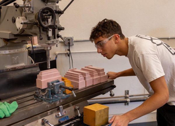 Senior Daniel Lavi operates a mill to shave off excess material